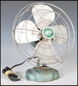 A vintage mid 20th Century industrial McGraw Electric Company 'Zero' desk fan model number 1250R,