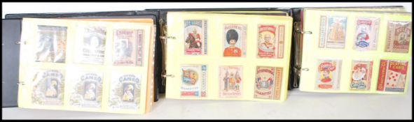 A collection of vintage 20th Century cigarette boxes over three albums, brands to include Life