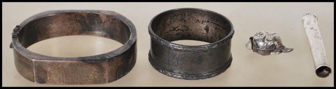 A collection of silver items to include a silver slave bangle in the brutalist manner stamped 925