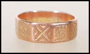 A 19th Century Victorian hallmarked 9ct gold ring having a faceted design with engraved geometric