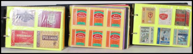 A collection of vintage 20th Century cigarette boxes over three albums, brands to include Speedboat,