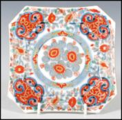 An 18th Century Chinese plate of octagonal form having hand painted floral decoration with a central