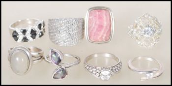 A selection of stamped 925 silver dress rings to include a ring set with two tear drop shaped mystic