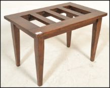 A Victorian 19th century Arts & Crafts oak coaching stand / luggage table. Raised on squared legs