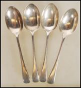 A group of four early 20th Century Edwardian English hallmarked silver spoons by Charles Boyton &