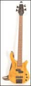A 20th Century Tanglewood Rebel four string bass guitar, honey finish to the body, ebonised head and