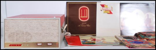 A vintage 20th Century tone tone Alba 212 portable record player, the red and grey case housing a