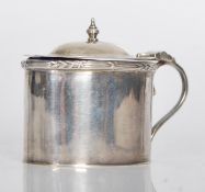 A silver hallmarked lidded mustard pot, scroll handle with final to hinged lid, Bristol blue glass