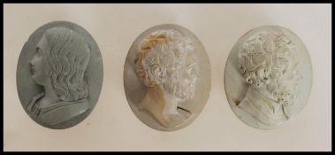 A group of three early 20th Century antique lava cameo's of oval form each embossed with with