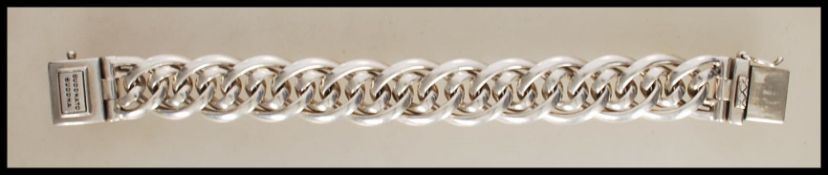A stamped 925 silver designer Buddha to Buddha bracelet having a interwoven link design with a