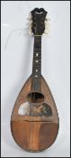 An vintage early 20th Century eight string rosewood cased mandolin instrument, with mother of