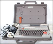 A retro 20th Century Epson HX-20 (also known as the HC-20) laptop and printer in original carry case