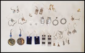 A selection of silver earrings to include drop earrings and stud, to include a pair of pierced
