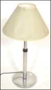 A 20th Century Art Deco style chrome table lamp raised on a circular base having a two part