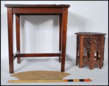 An early 20th Century carved hardwood occasional table from Sri Lanka, the rectangular top carved in