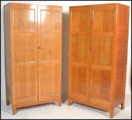 A pair of 20th Century Air Ministry Staverton oak wardrobes, each robe with full length panel
