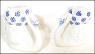 A 20th Century pair of Chinese blue and white glazed ceramic planter / plant stands / stools