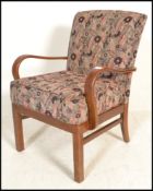 A 20th Century vintage Parker Knoll open framed bentwood armchair, the overstuffed seat pad and