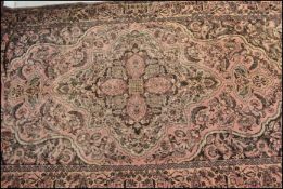 A 20th Century Persian Islamic runner floor rug having a red ground with black floral patterned