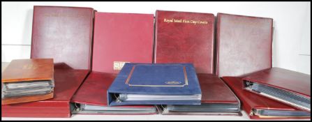 Stamps - A large collection of Great British Royal Mail first day covers across eleven albums to