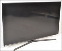 A large modern Samsung Flat Screen TV / Television believed to be 43