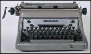A vintage 20th Century industrial typewriter by Smiths Corona, enamel finish with makers mark to