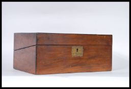 A 19th Century Victorian walnut veneer writing slope having brass escutcheon and brass cartouche