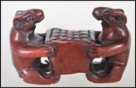 A 20th Century Japanese boxwood carved netsuke in the from of two mice. Measures 4cm tall by 7cm