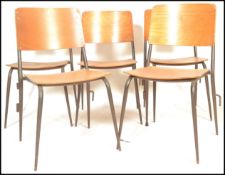 A set of 5 mid 20th century bentwood and tubular metal industrial stacking chairs. Each with painted