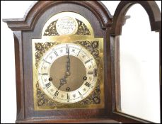 An early 20th Century Edwardian panel oak cased gr