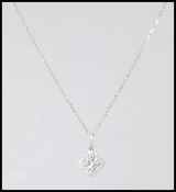 A hallmarked 18ct yellow gold necklace having a pe