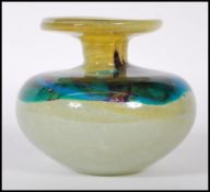 A vintage studio yellow and turquoise swirl glass