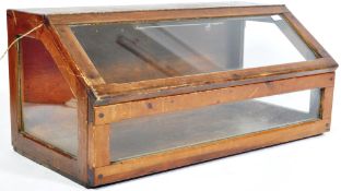 EARLY 20TH CENTURY OAK SHOP DISPLAY CABINET WITH DROP FRONT DOOR