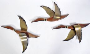 SET OF THREE GRADUATING WALL HANGING BRASS AND TEAK BIRDS