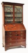 A GEORGE III 18TH CENTURY MAHOGANY INLAID BUREAU BOOKCASE