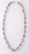 A 19TH CENTURY GOLD AND AMETHYST RIVIÉRE NECKLACE