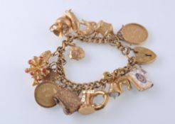 A HALLMARKED 9CT GOLD CHARM BRACELET