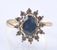 9CT GOLD SAPPHIRE AND DIAMOND CLUSTER RING APPROX 20PNTS