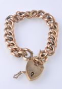 A HALLMARKED 9CT GOLD CURB CHAIN BRACELET