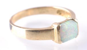 A 14CT GOLD AND SYNTHETIC OPAL RING