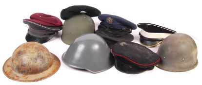 COLLECTION OF ASSORTED MILITARY UNIFORM HELMETS & CAPS
