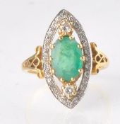 A HALLMARKED 18CT GOD EMERALD AND DIAMOND RING