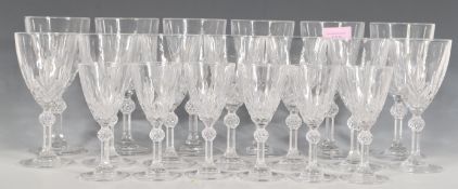 A collection of cut lead crystal drinking glasses