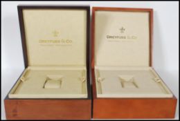 A pair of 20th Century mahogany watch cases, the h