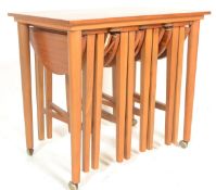 A vintage mid 20th Century teak side - nest of tab