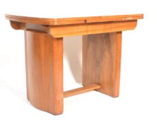 A 1930's Art Deco walnut refectory draw leaf dinin