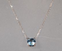 An 18ct white gold drop pendant necklace set with