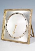 A 20th Century desk top clock having a square bras