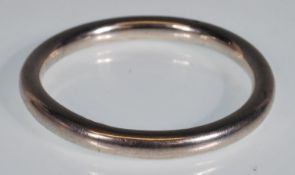 A stamped 925 silver bangle of typical form. Measu