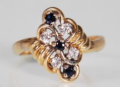 A hallmarked 9ct gold sapphire and white stone dre